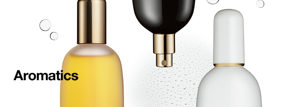 Drei Parfumflakons in Gelb, Schwarz und Weiß mit goldenen Verschlüssen vor weißem Hintergrund, links der Schriftzug 'Aromatics'.