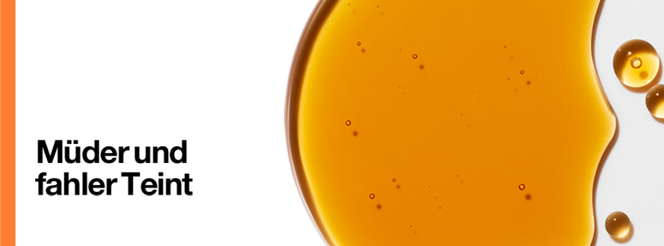 Großer orangefarbener Tropfen eines Pflegeöls mit kleineren Tröpfchen auf weißem Hintergrund. Links steht der Text 'Müder und fahler Teint' mit einem orangefarbenen Randbalken.