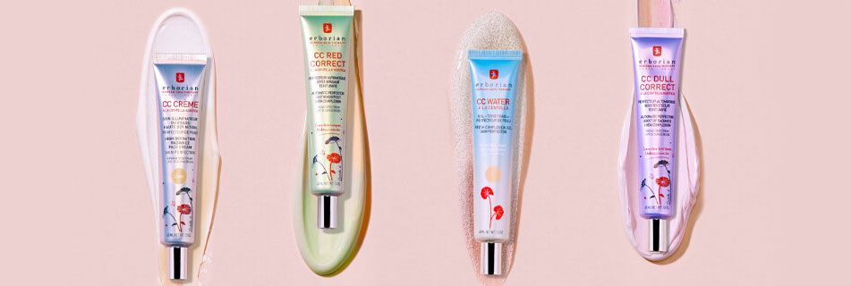 Vier Tuben CC-Produkte von Erborian nebeneinander auf pastellfarbenem Hintergrund: CC Crème, CC Red Correct, CC Water und CC Dull Correct – jeweils mit passender Produkttextur im Hintergrund aufgetragen.