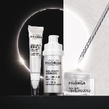 Filorga Skin-Unify Pflegeserie mit drei Produkten in weiß-silbernem Design: eine Tube, ein Pumpspender und ein Cremetiegel mit Pipette. Die Produkte stehen vor einem kontrastreichen Hintergrund mit schwarzer und weißer Hälfte und einem leuchtenden Lichtkreis.