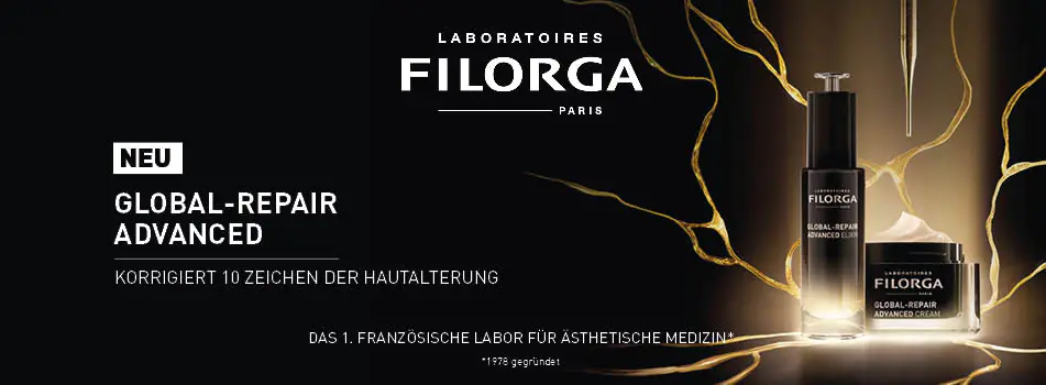 Werbung für Filorga Global-Repair Advanced. Links der Text: 'Neu – Korrigiert 10 Zeichen der Hautalterung'. Rechts zwei Produkte in schwarzer Verpackung – ein Serum mit Pipette und eine Creme – vor einem gold-schwarz leuchtenden Hintergrund mit Rissstruktur.